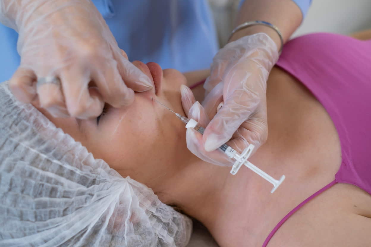 focused-care-during-a-cosmetic-injection-demonstr-2025-02-21-15-42-57-utc